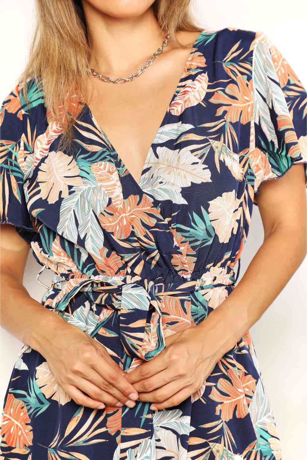 The Vivi Botanical Print Surplice Neck Tie Waist Romper - PEONIES & LIME