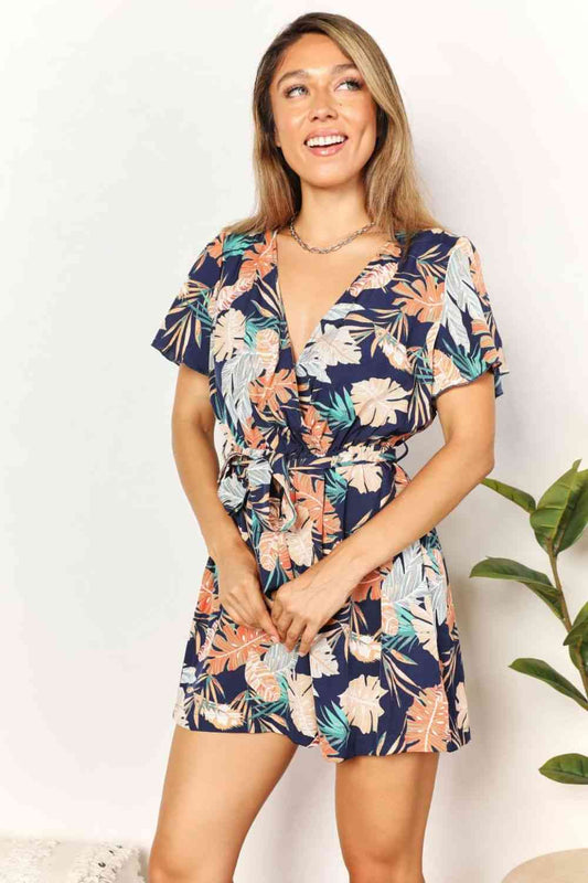 The Vivi Botanical Print Surplice Neck Tie Waist Romper - PEONIES & LIME